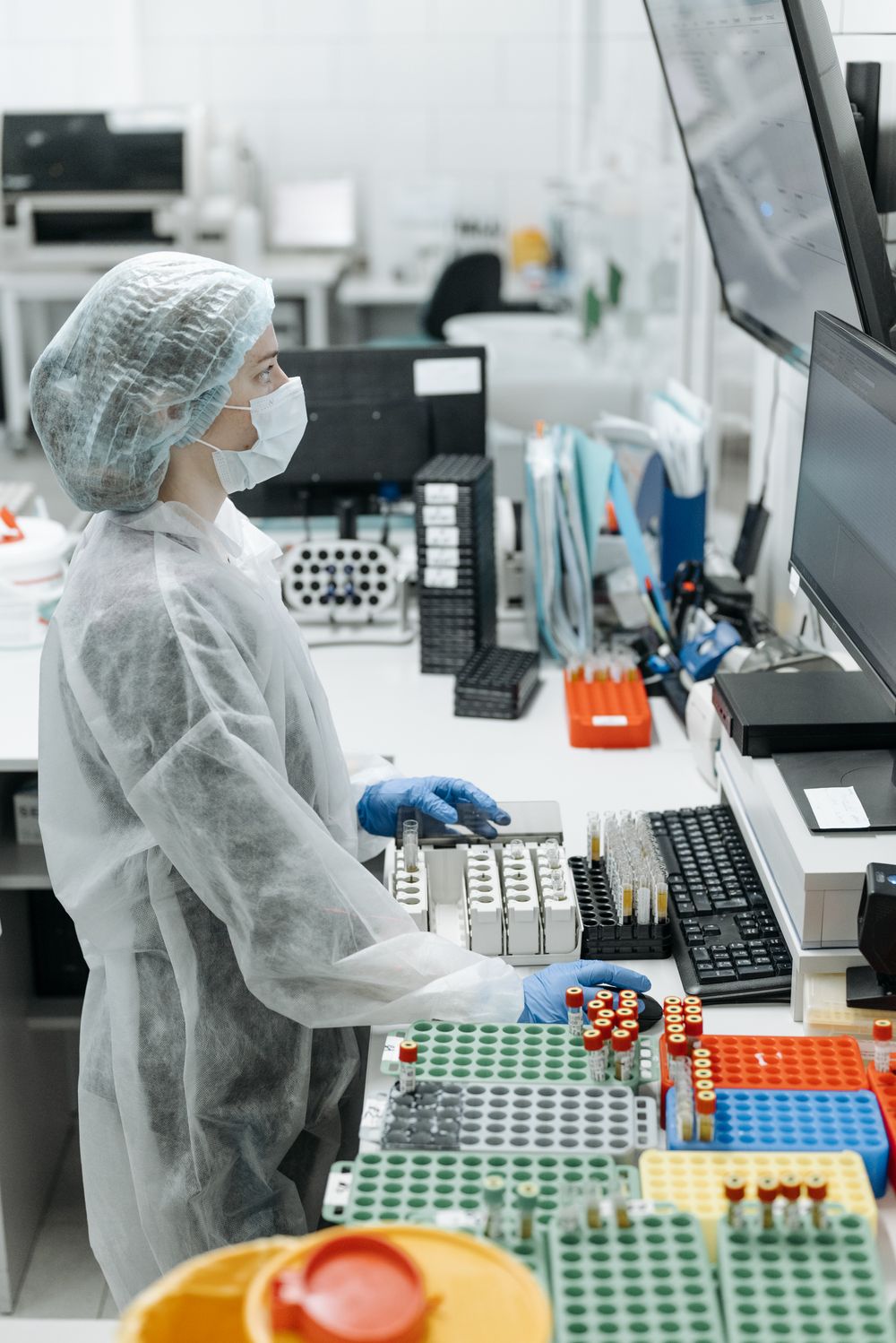Laboratory scientist analyzing samples on a computer